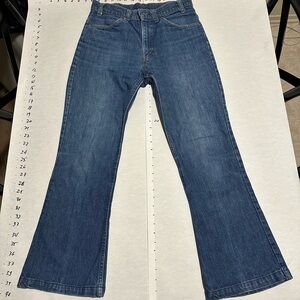 Vintage Levis rare big E hi waist bell bottom jeans. Fits 27-28.